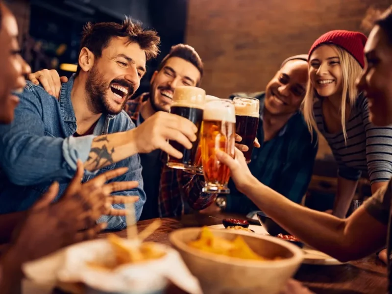 Friends enjoying a pint at the pub.