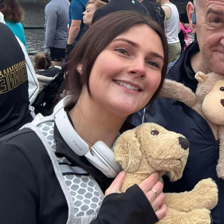 Charlotte Browning with a plush toy dog.