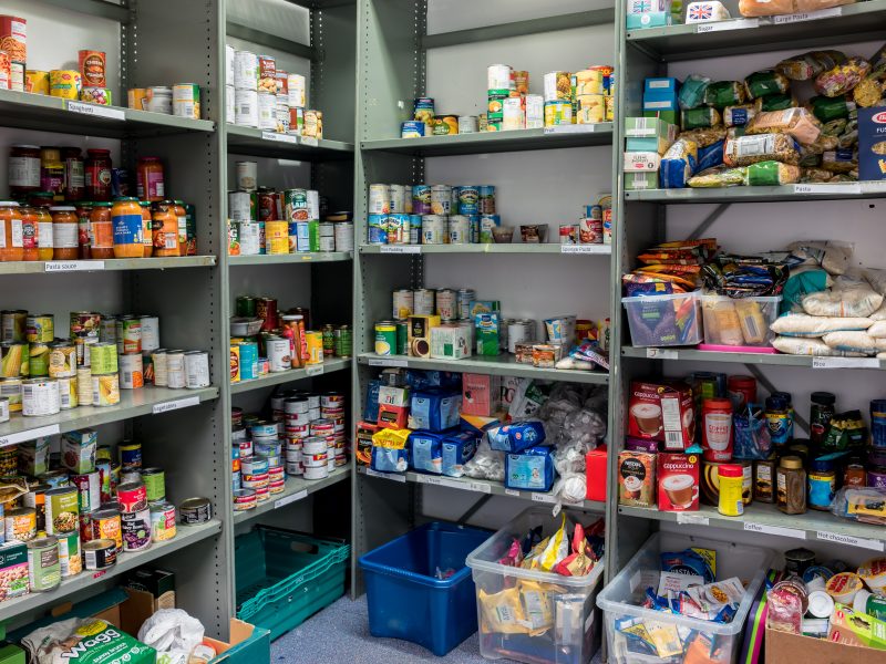 a variety of tins and store cupboard essentials ready for food parcels
